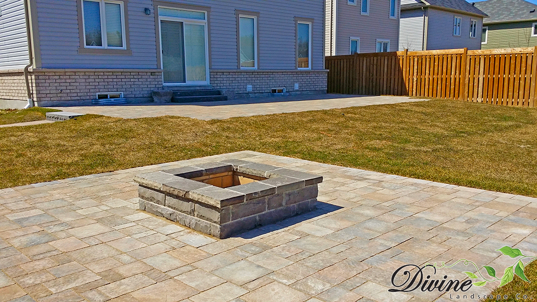 Custom stone fire pit and surrounding patio